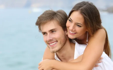 happy-couple-love-perfect-smile-beach-looking-away-136069304